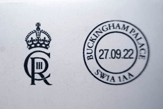 King Charles III’s cypher is used by government departments and by the Royal Household for franking mail.