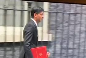 Rishi Sunak leaves Downing Street in 2020 with a burgundy coloured ring binder.