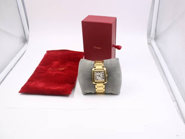 A Cartier watch, which was discovered in a bag of donations to the British Heart Foundation, has sold for almost £10,000 on eBay.