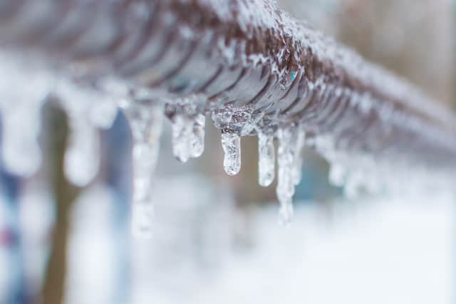 Icicles on a pipe.