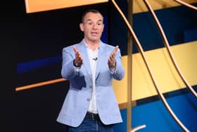 Martin Lewis pictured on set of The Martin Lewis Money Show, gesturing to the audience (Credit: Multistory Media/Jonathan Hordle/ITV)