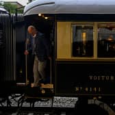 A man disembarks from the Venice Simplon-Orient-Express after arriving at Istanbul Station in Istanbul (Photo by YASIN AKGUL/AFP via Getty Images)