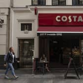 LONDON, ENGLAND - AUGUST 31: Customers sit outside a Costa Coffee store on August 31, 2018 in London, England. Coca-Cola Co. is to buy the U.K. chain Costa Coffee for £3.9 billion GBP, ($5.1 billion USD). (Photo by Dan Kitwood/Getty Images)