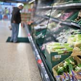 A shopper browses for fruit and vegetables in a Tesco supermarket in London on December 14, 2020 (Getty Images)