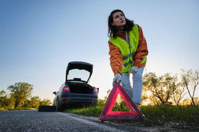 Use a reflective triangle to keep you and other road users safe (photo: Shutterstock)