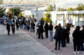 Cypriots wait in line to receive the third dose of a Covid-19 vaccine at a walk-in vaccination centre (Photo: Getty Images)