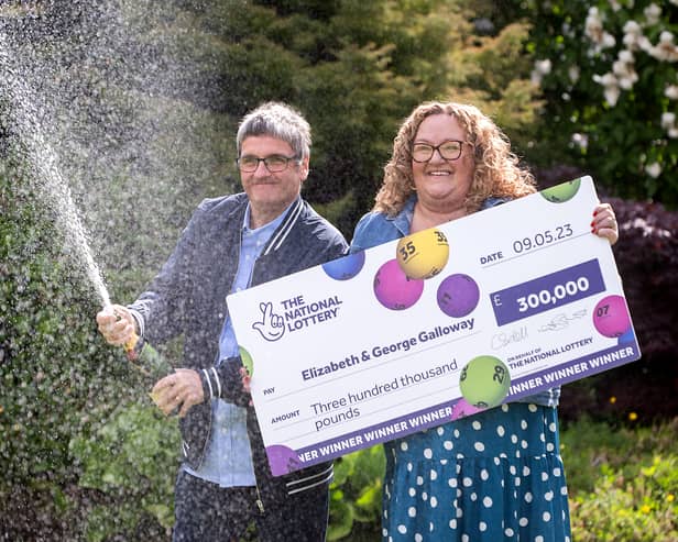 National Lottery winners Liz and George Galloway celebrate after winning Â£300,000 on the National Lottery Bingo Bonus Scratch card in Glasgow. (Photo: Anthony Devlin)