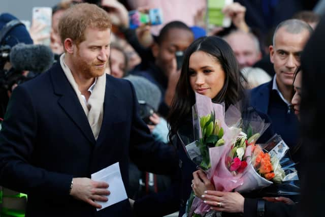 Prince Harry and his then-fiancee, now wife, US actress Meghan Markle arrive to visit the Terrence Higgins Trust World AIDS Day charity fair at Nottingham Contemporary on December 1, 2017