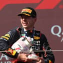 Max Verstappen holds the broken Hungarian Grand Prix trophy 