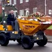 Dave Newton's funeral with his coffin in a dumper truck. 