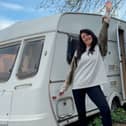 Hayley Rubery in front of her caravan. 