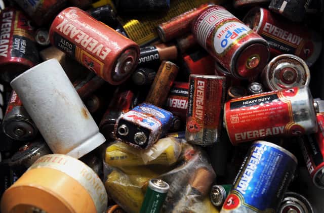 A pile of dead batteries. Photo: Manjunath Kiran/AFP via Getty Images