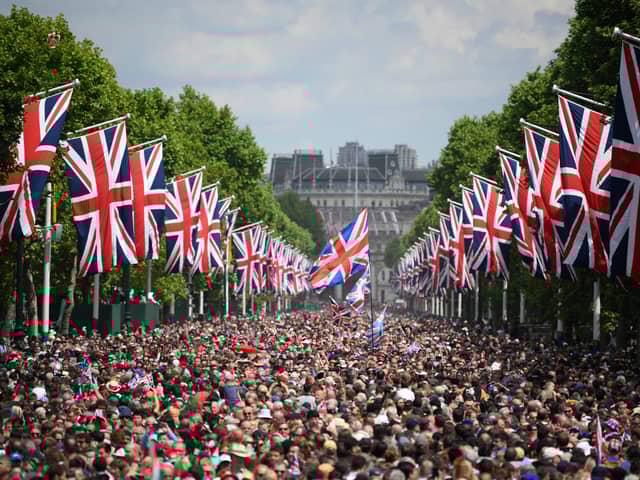 Members of the public fill The Mall before a flypast during the Queen's Birthday Parade, the Trooping the Colour, as part of Queen Elizabeth II's Platinum Jubilee celebrations in London in June 2022 (Photo: DANIEL LEAL/POOL/AFP/AFP via Getty Images)