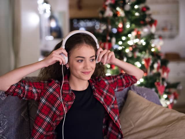 Woman listening to Christmas music.