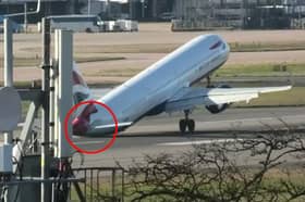 Tail of British Airways jet hits runway during aborted landing.
