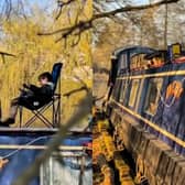 A dad is raising his sons on boats - with 'cinema' and study nook.