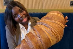 Emmanuella Okpoko with the massive croissant at P&D Gran Caffè in Liverpool.