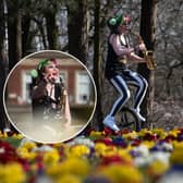 Rachel Ward plays the saxophone while riding a unicycle in Stanley Park