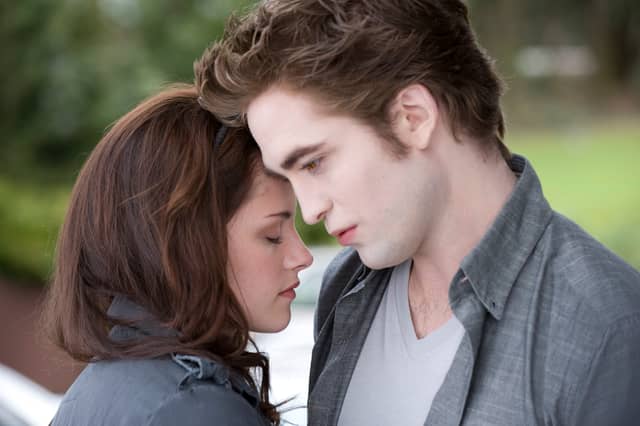 Kristen Stewart as Bella Swan and Robert Pattinson as Edward Cullen in The Twilight Saga New Moon.