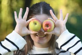 Apple Day at Ripon Walled Garden.
Pictured Evie Brown with apples for eyes.
Picture Gerard Binks