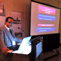 Consultant spinal surgeon Mr Raman Kalyan delivering an expert presentation on spinal conditions and treatment options.