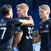 Ciaran McGuckin, centre, is congratulated by Josh Hmami, left, and Michael Craig after finding the back of the net against Bury FC. Picture: Matt Kirkham