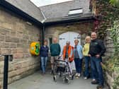 Meryl Castle, chairperson of Killinghall Village Hall (third from the right), with the rest of the committee and Mike Kaye, founder and director at Energy Oasis (right).