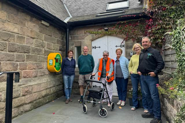 Meryl Castle, chairperson of Killinghall Village Hall (third from the right), with the rest of the committee and Mike Kaye, founder and director at Energy Oasis (right).