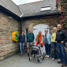 Meryl Castle, chairperson of Killinghall Village Hall (third from the right), with the rest of the committee and Mike Kaye, founder and director at Energy Oasis (right).