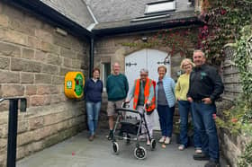 Meryl Castle, chairperson of Killinghall Village Hall (third from the right), with the rest of the committee and Mike Kaye, founder and director at Energy Oasis (right).