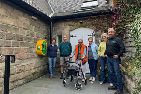 Meryl Castle, chairperson of Killinghall Village Hall (third from the right), with the rest of the committee and Mike Kaye, founder and director at Energy Oasis (right).