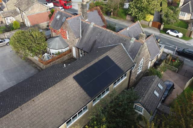 The project includes a roof-mounted solar panel system.
