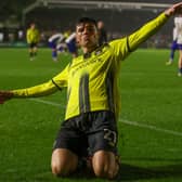 Ellis Taylor celebrates after firing Harrogate Town into a 2-1 lead against Bury FC. Picture: Matt Kirkham