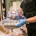 A member of North Yorkshire Council’s trading standards team with confiscated cigarettes and tobacco.