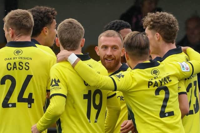 Harrogate Town's players celebrate after George Thomson fired them into a three-goal lead at home to Sutton United. Picture: Matt Kirkham
