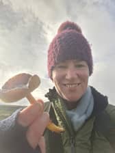 Nidderdale National Landscape biodiversity officer Dr Kelly Harmar with the rare date waxcap found during a grassland fungi survey.