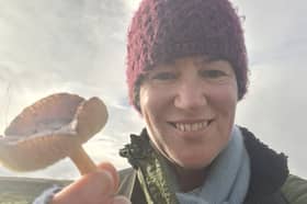 Nidderdale National Landscape biodiversity officer Dr Kelly Harmar with the rare date waxcap found during a grassland fungi survey.