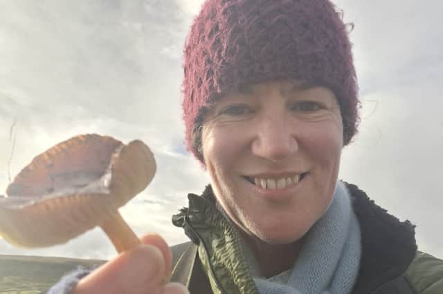 Nidderdale National Landscape biodiversity officer Dr Kelly Harmar with the rare date waxcap found during a grassland fungi survey.