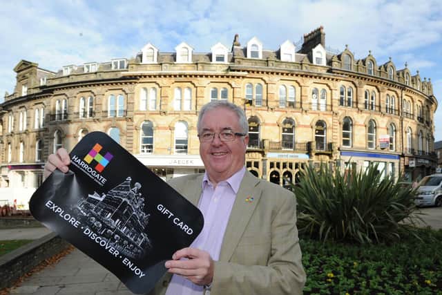 Boost for Harrogate town centre shops - Harrogate BID chair John Fox with the new Harrogate Gift Card (not real size!).