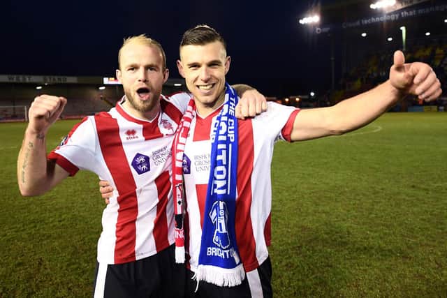 Jack Muldoon, right, enjoys Lincoln City's 3-1 win over Brighton.