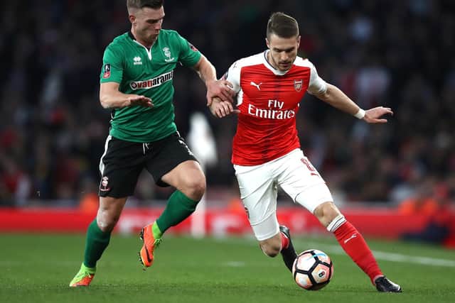 Jack Muldoon battles Arsenal's Aaron Ramsey for possession in the 2016/17 FA Cup quarter-finals.