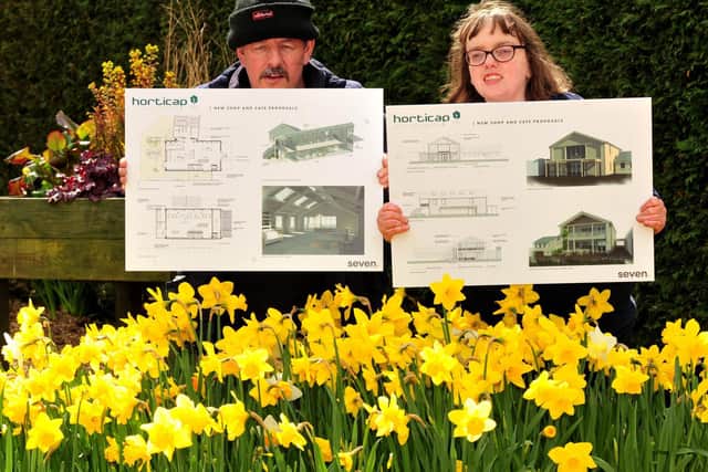 Pictured with the plans for the new cafe and shop are Timothy Simpson and Vicky Taylor. Picture: Gerard Binks.
