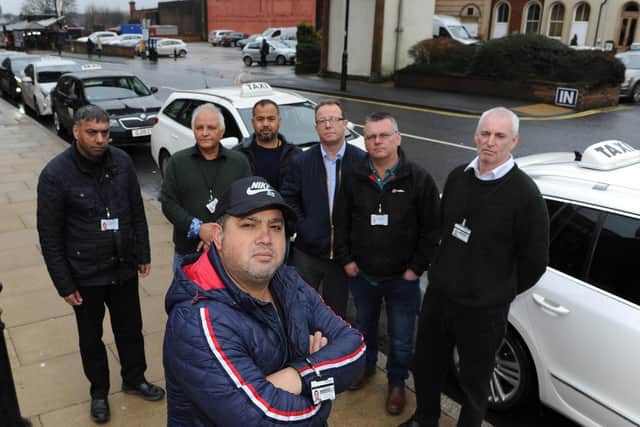 Shahpoor Osman with Harrogate taxi drivers on the Station Parade taxi rank. Picture: Gerard Binks.