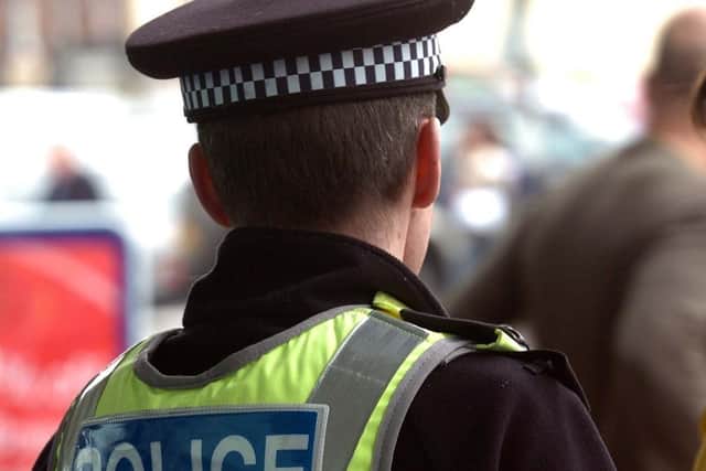 A woman has been threatened at knifepoint in a robbery near a Harrogate supermarket.