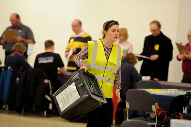 Ballot boxes are rushed in as the General Election count gets underway at the Harrogate Convention Centre.