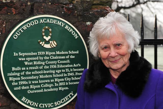 School governor Alma Williams with the plaque. Picture: Gerard Binks.