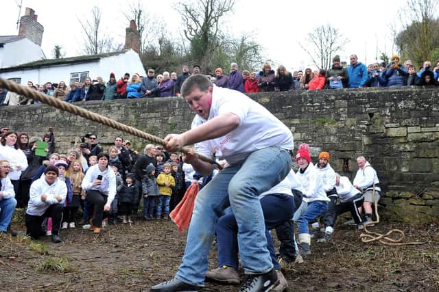 The men's Mother Shipton's team taking part in the annual Boxing Day tug of war tradition.