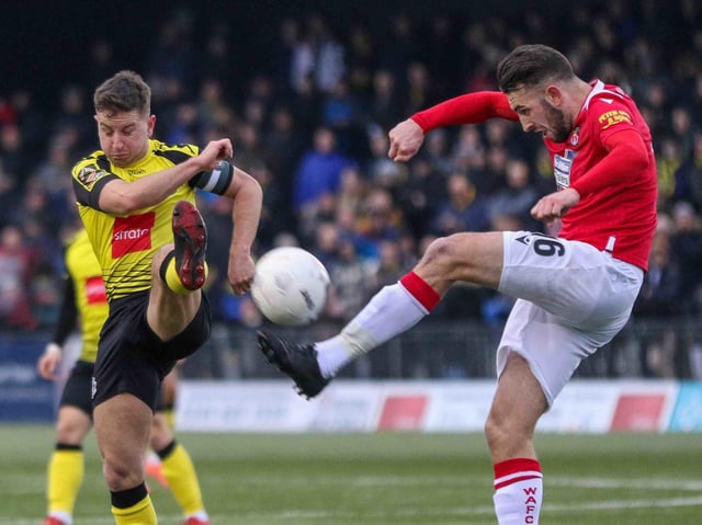 Josh Falkingham challenges Kieran Kennedy during Harrogate Town's home defeat to Wrexham. Picture: Matt Kirkham