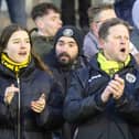 Harrogate Town supporters Molly Worton, left, and Dave Worton, centre, watch on during Saturdays FA Trophy quarter-final triumph at AFC Fylde. Picture: Matt Kirkham