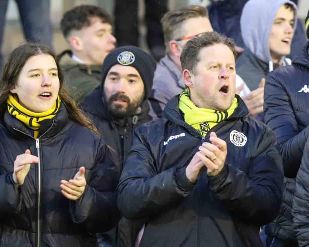 Harrogate Town supporters Molly Worton, left, and Dave Worton, centre, watch on during Saturdays FA Trophy quarter-final triumph at AFC Fylde. Picture: Matt Kirkham